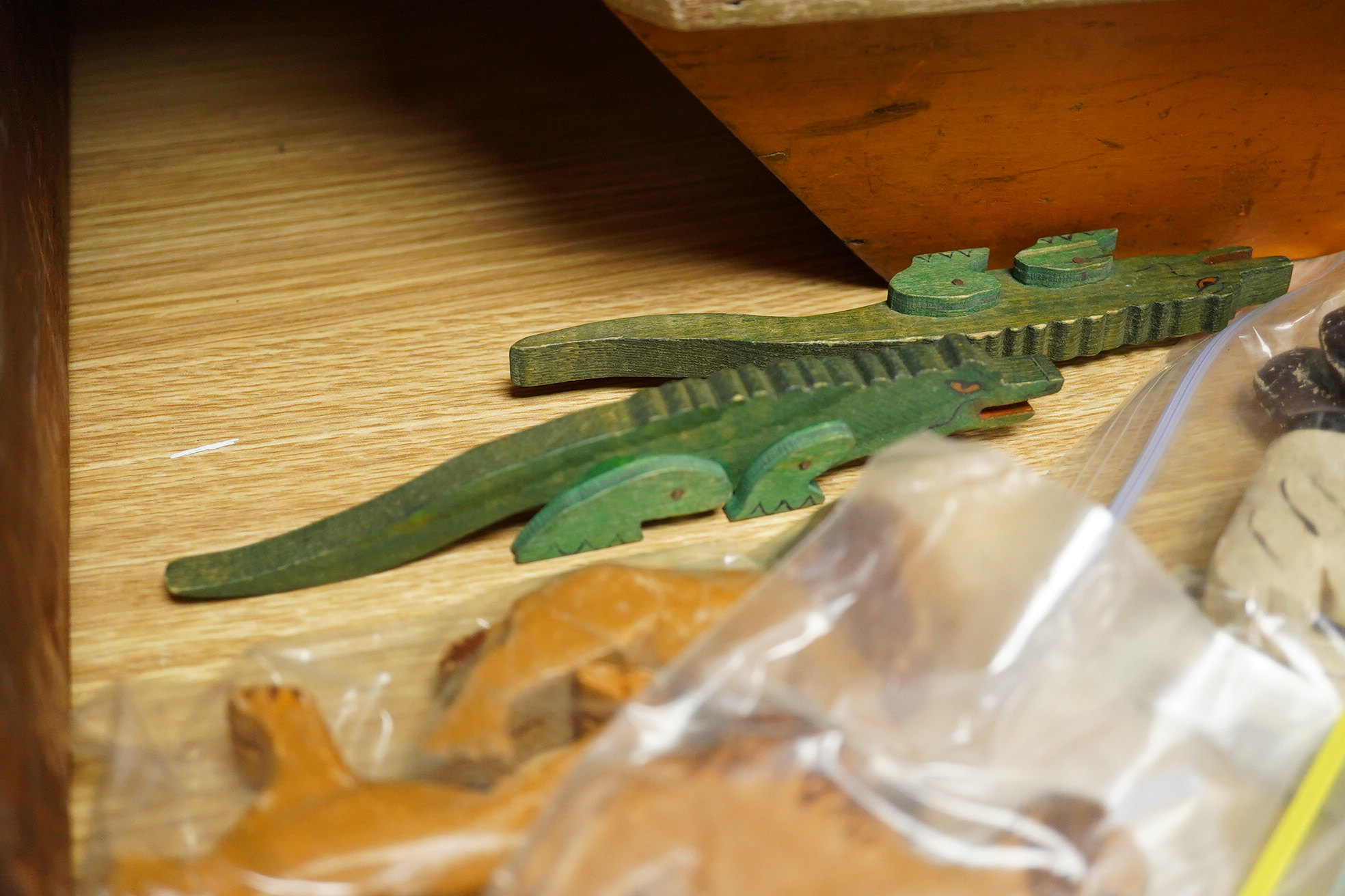 A First World War ‘War Relief Toy Work’ painted pine Noah's Ark with a quantity of carved and painted wooden animals, the ark with hinged lid, label pasted to the inside of the lid stating; Made in England, with a biblic
